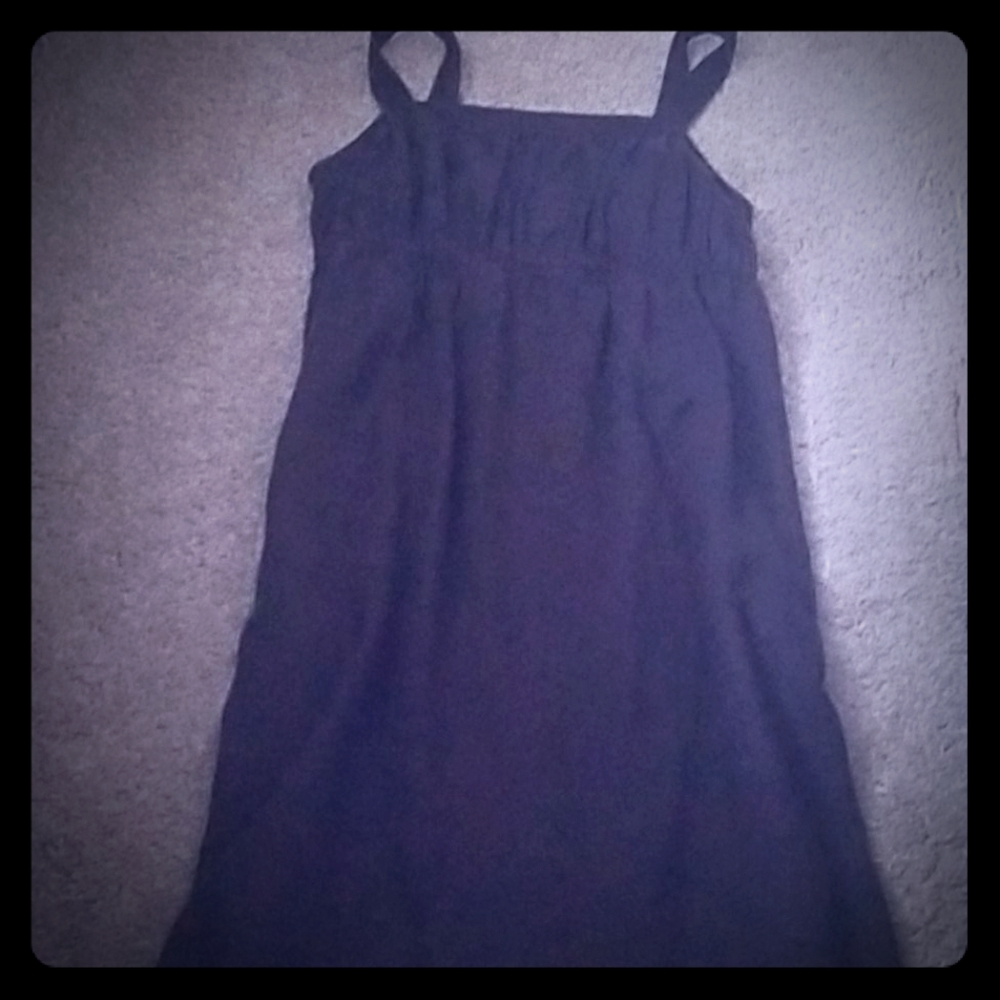 Linen sundress w/ side slit pockets.